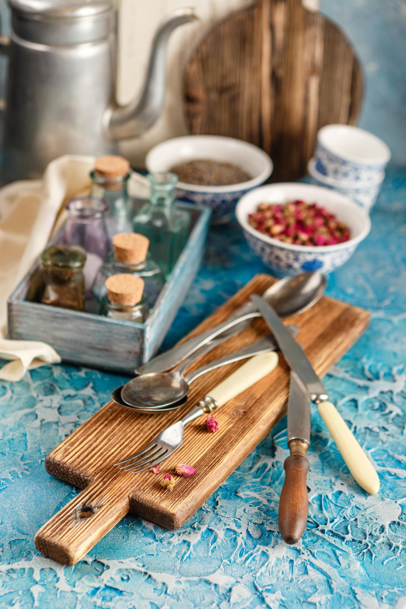 rustic kitchen workspace with herbs and utensils